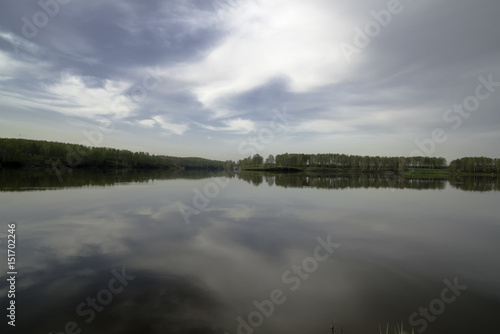 Morning spring landscape on the lake.