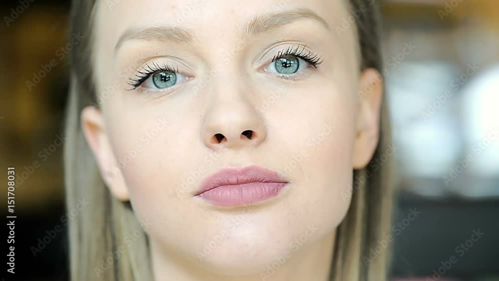 Beautiful, young girl looking to the camera and smiling
