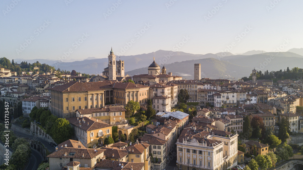 Drone aerial view of Bergamo - Old city. One of the beautiful city in Italy. Landscape on the city center, its historical buildings and towers during a wonderful blu day