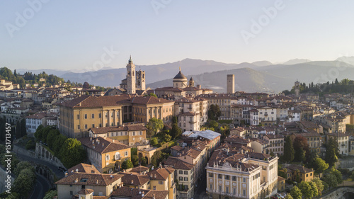 Drone aerial view of Bergamo - Old city. One of the beautiful city in Italy. Landscape on the city center, its historical buildings and towers during a wonderful blu day