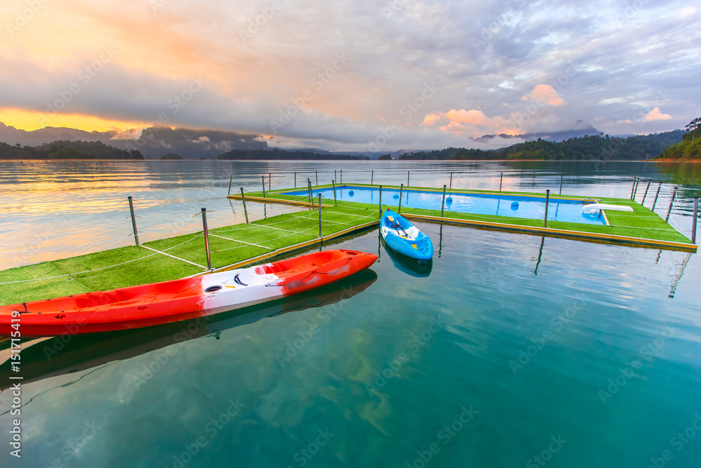 Fototapeta premium Tropical resort. Poolside with beautiful lake view