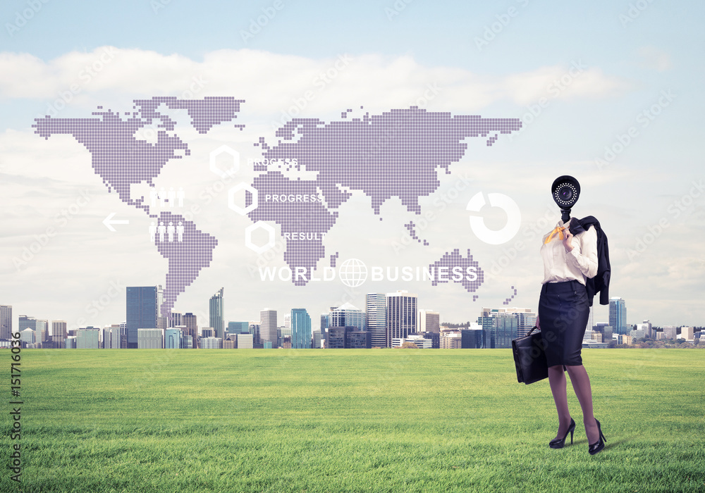 Camera headed woman standing on green grass against modern citys Camera headed woman standing on green grass against modern citys