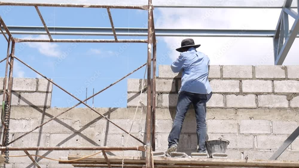Wall construction worker build concrete wall by cement block. Wall construction worker build concrete wall by cement block.