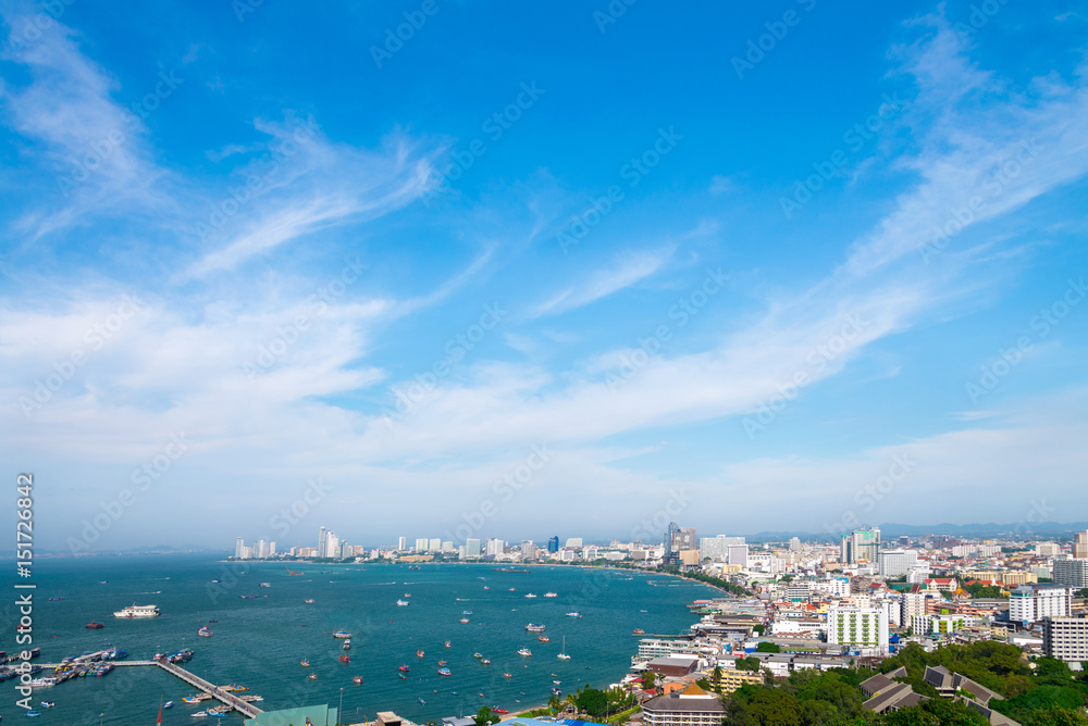 Pattaya cityscape and pattaya sea bay in top view with blue sky and cloud is city is famous tourist Attractions about sea sport and night life entertainment, Chon Buri, Thailand