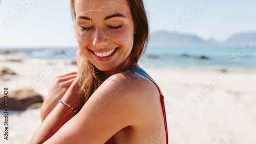 Young woman posing on the beach photo