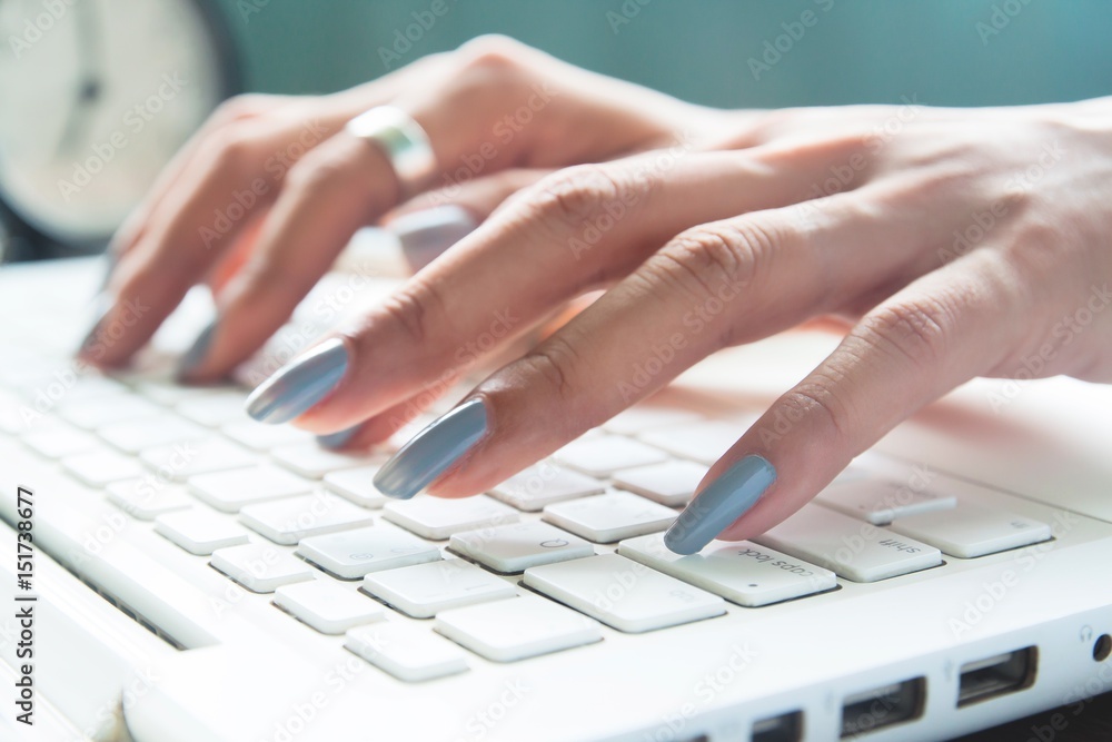 Close up of female fingers using laptop, Working woman and Online shopping concept, Selective focus Close up of female fingers using laptop, Working woman and Online shopping concept, Selective focus