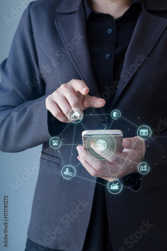 Wallpaper Mural Business man using mobile payments online shopping with Mobile banking word and icon customer network connection on screen. Digital financial business concept Torontodigital.ca