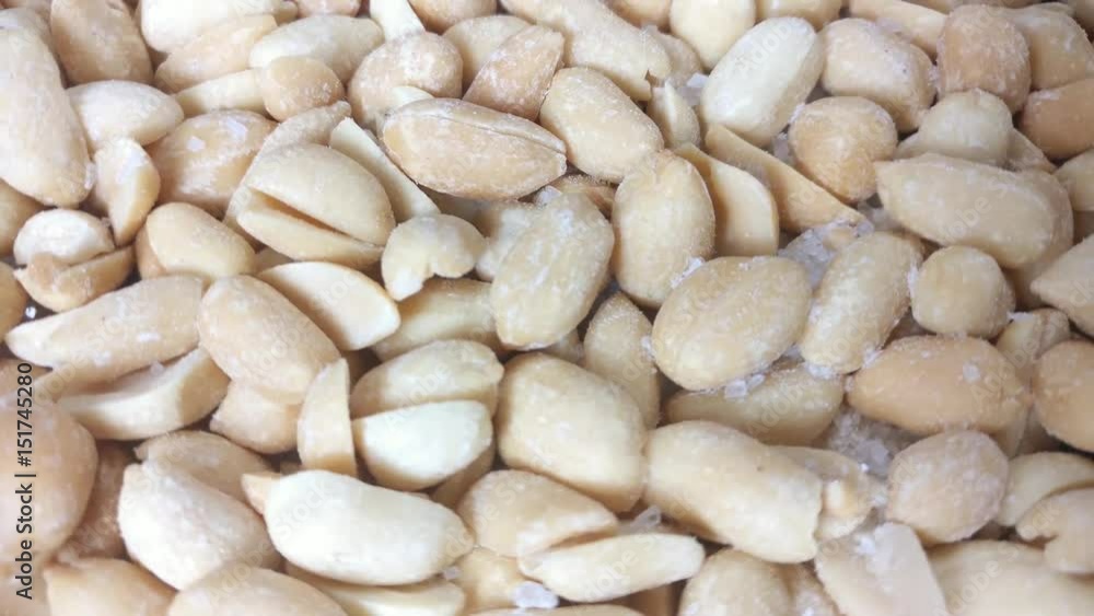 Peanuts rotating.
Pouring salt on rotating prepared roasted peanuts. Close up.
Peanuts rotating.
Pouring salt on rotating prepared roasted peanuts. Close up.