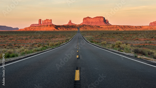 Straight Road vanishing into Monument Valley