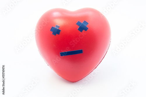 Heart shape with emotion dead smile. Concept photo visualizing death, broken heart of love, failure, cardiac arrest, myocardial infarction, severe cardiac disease or cardiovascular system photo