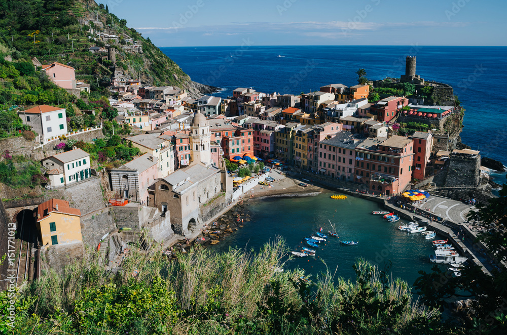 Scenic overview of Vernazza village on bright summer sunny day, Cinque Terre National Park, Unesco world heritage, La Spezia region, Liguria. Picturesque scene.