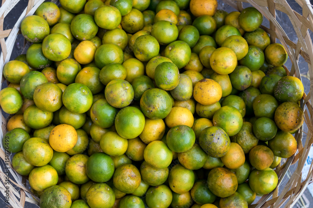 Fresh mandarin oranges on an organic food market of tropical Bali island, Indonesia. Mandarin background.