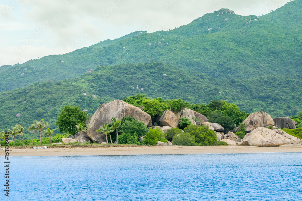 Stone sea shore at a paradise island -the South China sea - Vietnam Nha Trang bay