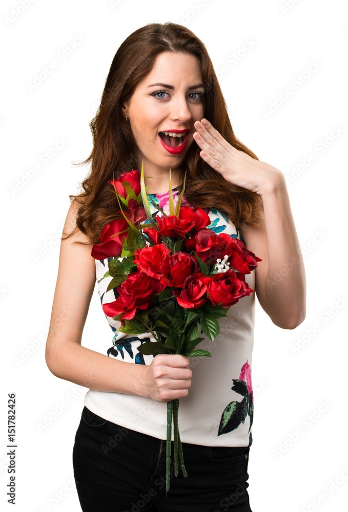 Beautiful young girl holding flowers making surprise gesture Beautiful young girl holding flowers making surprise gesture