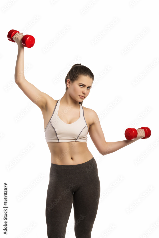 Beautiful young sporty fitness woman with dumbbells Beautiful young sporty fitness woman with dumbbells
