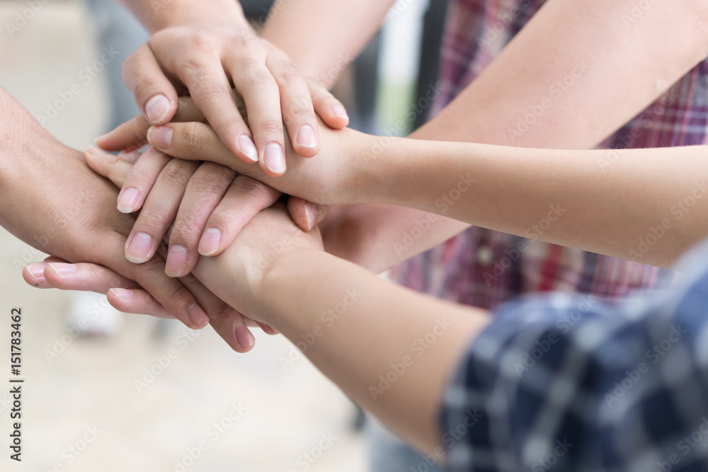 young college student joining hand, business team touching hands together - unity, harmony, teamwork, friends concept young college student joining hand, business team touching hands together - unity, harmony, teamwork, friends concept