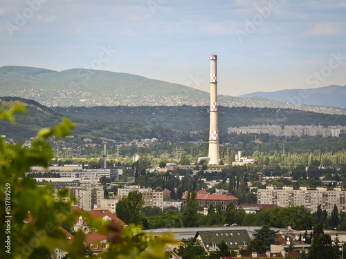 Foto Industrial chimney in green environment
