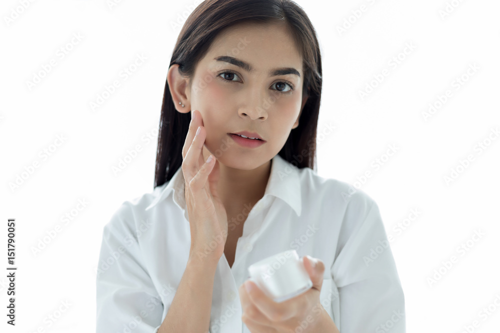 A beautiful woman asian using a skin care product, moisturizer or lotion taking care of her dry complexion. Moisturizing cream in female hands . A beautiful woman asian using a skin care product, moisturizer or lotion taking care of her dry complexion. Moisturizing cream in female hands .