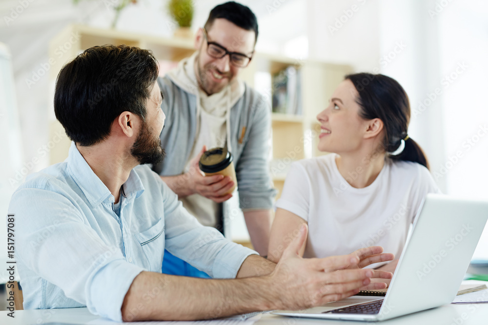 Group of happy managers having discussion of project Group of happy managers having discussion of project
