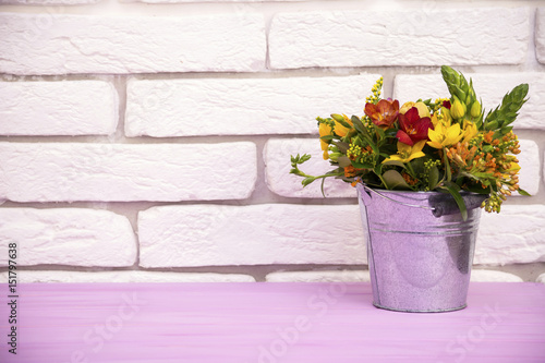 bouquet of flowers in a bucket