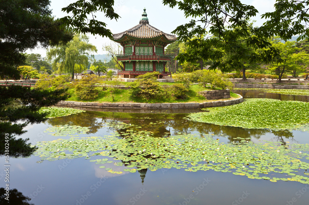 Seoul. The Gyeongbokgung Palace. Pavilion Hyangwonjeong in a beautiful park landscape with a lotus pond on a summer day Seoul. The Gyeongbokgung Palace. Pavilion Hyangwonjeong in a beautiful park landscape with a lotus pond on a summer day