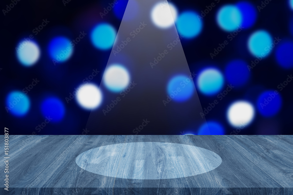 Wood table top on bokeh blue background, reflect lighting- can be used for display or montage your products.