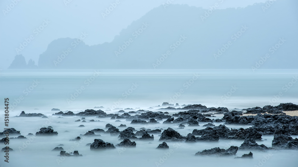 rockyshore with soft scene of wave of the sea cause of it's raining