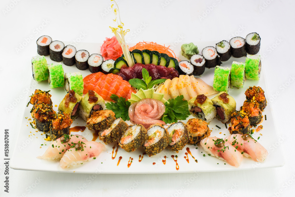 Colorful Sushi Set and sushi rolls served on white background