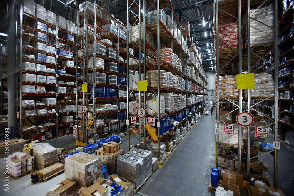 Modern warehouse with lots of packed goods on shelves Modern warehouse with lots of packed goods on shelves
