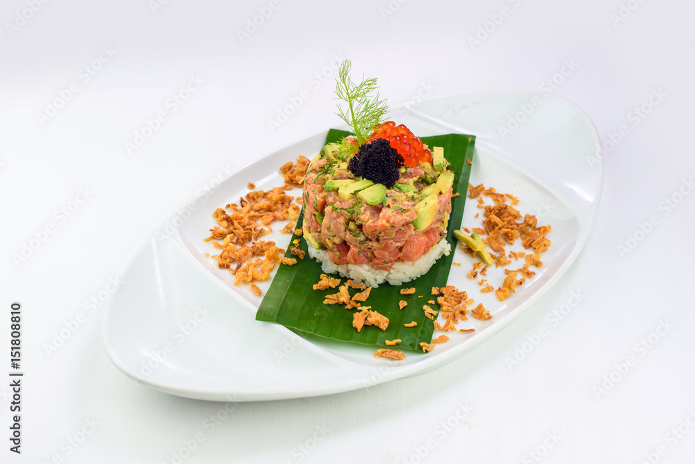Smoked salmon tartare with avocado, rice and caviar Smoked salmon tartare with avocado, rice and caviar