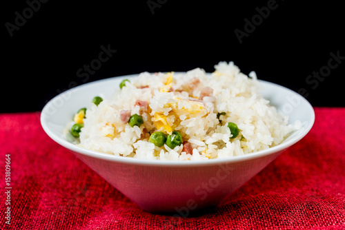 Homemade Chinese fried rice with vegetables and fried eggs