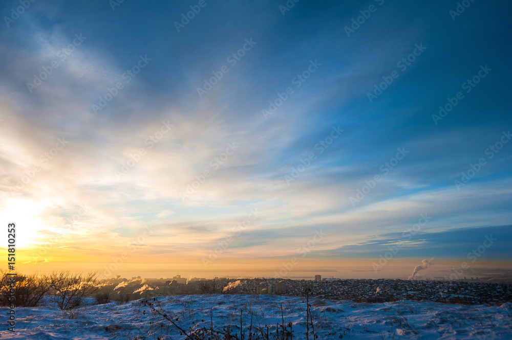 A beautiful winter dawn. Amazing sunset and the view is not the city from the mountain. Saratov, Russia