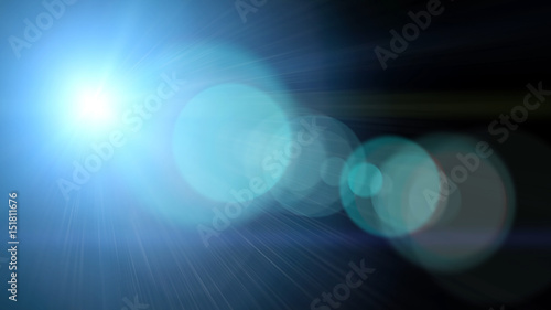 Bright light with lens flare. Blue abstract background with spotlight beam.