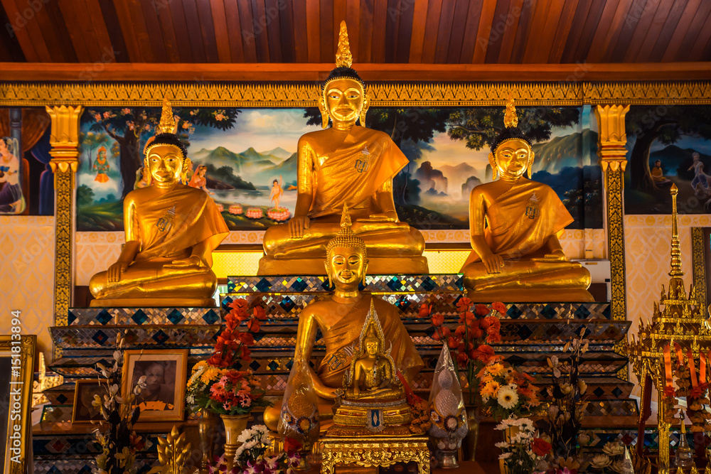 Obraz premium Thai temple interior with Buddha. Wat Patong Suwankeereewong Temple Phuket, Thailand.