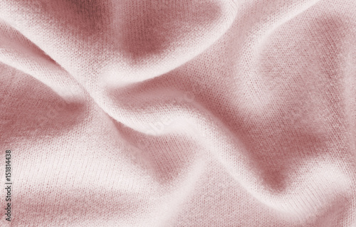 surface of a soft knitted fabric made of cashmere with large folds, a detail of clothes