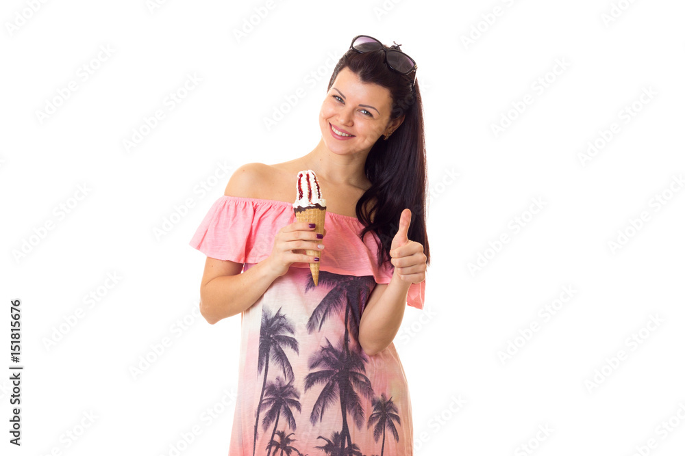 Woman in dress with sunglasses holding ice-cream Woman in dress with sunglasses holding ice-cream