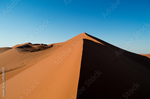 Plakat Climbing Big Daddy Dune during Sunrise, Looking at the Summit, Desert Landscape, Namibia