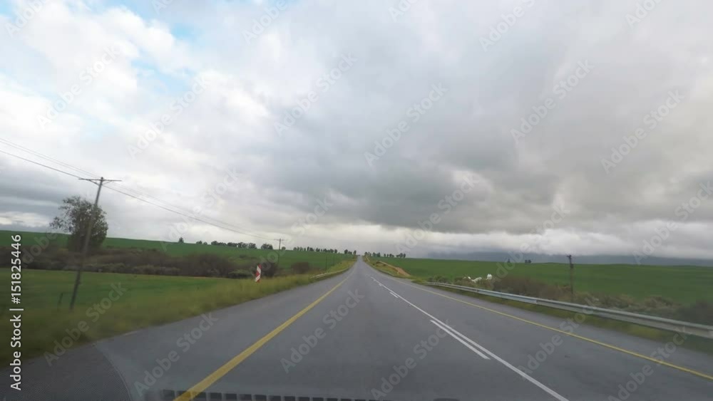 Driving on two lane road crossing the blooming Namaqualand in South Africa. View from car mounted camera. Driving on two lane road crossing the blooming Namaqualand in South Africa. View from car mounted camera.