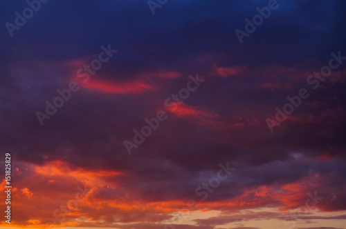 Sunset with clouds, in orange and purple shades
