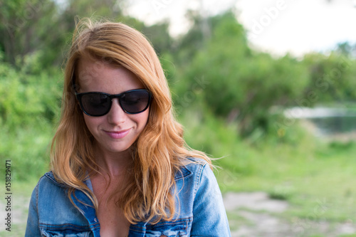 Red haired girl with sunglasses