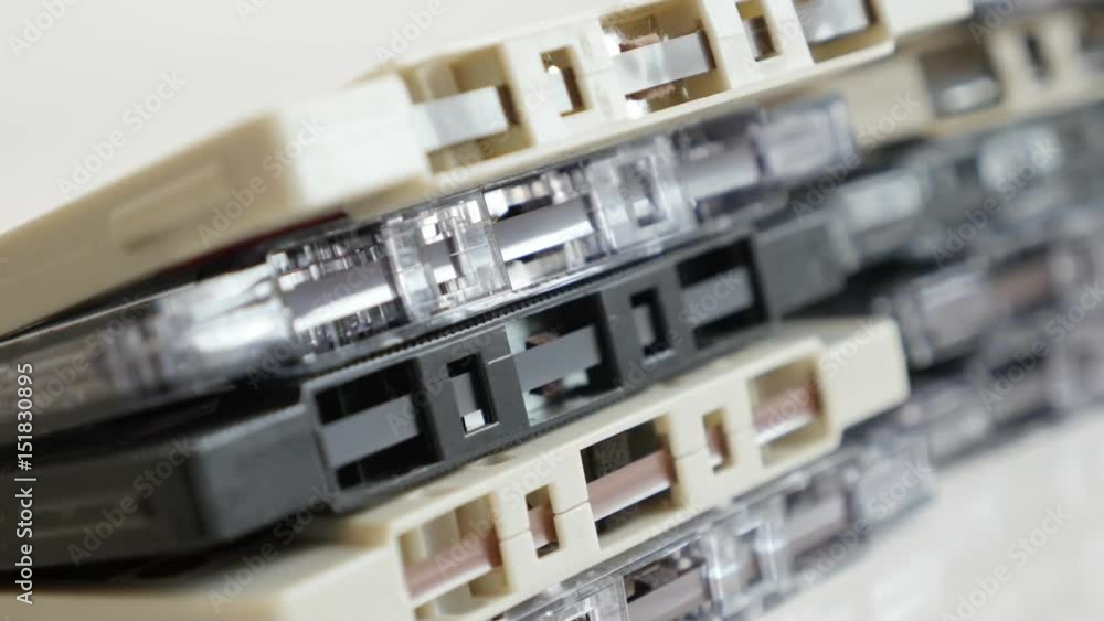 Shallow DOF archived retro compact audio cassettes stacked 4K 2160p 30fps UltraHD panning footage - Slow pan analogue magnetic tapes 3840X2160 UHD video Shallow DOF archived retro compact audio cassettes stacked 4K 2160p 30fps UltraHD panning footage - Slow pan analogue magnetic tapes 3840X2160 UHD video