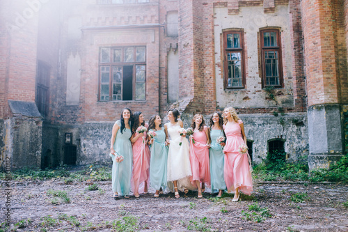 Beautiful bride with her pretty bridesmaids © shunevich