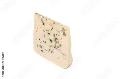 Slice of soft blue cheese with mold isolated