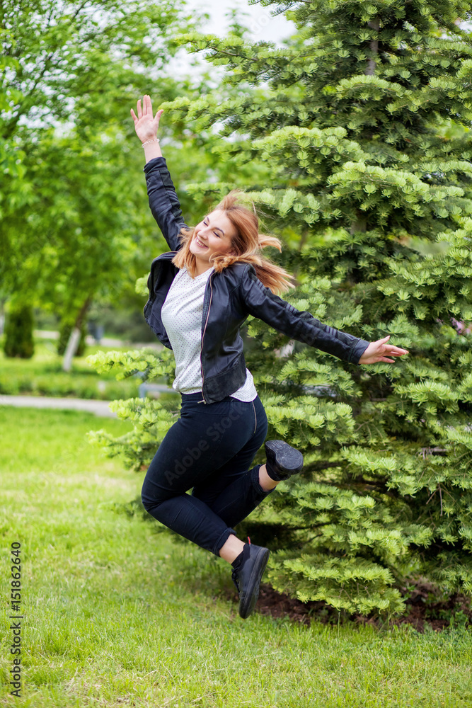 Woman jumping on path Woman jumping on path