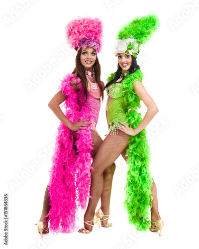 two carnival dancer women dancing against isolated white background