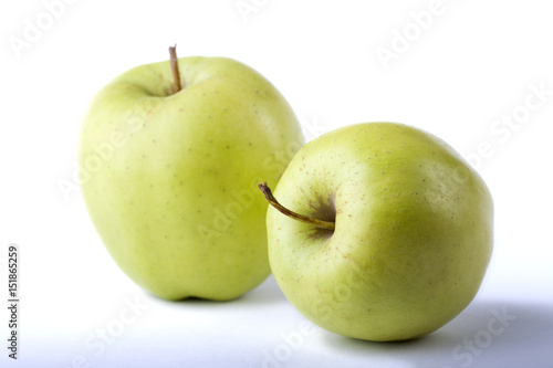 two green apples on the white background