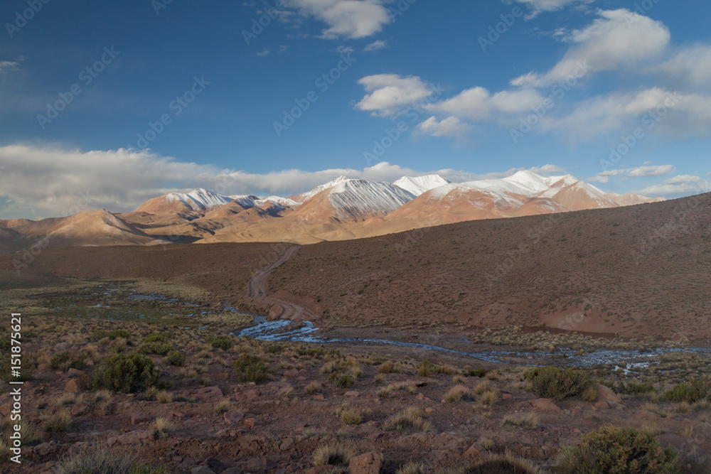 Snow covered mountains soaring from altiplano in Bolivia