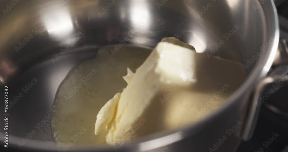 Slide shot of preparing bechamel sauce melting butter, 4k 60fps prores footage Slide shot of preparing bechamel sauce melting butter, 4k 60fps prores footage