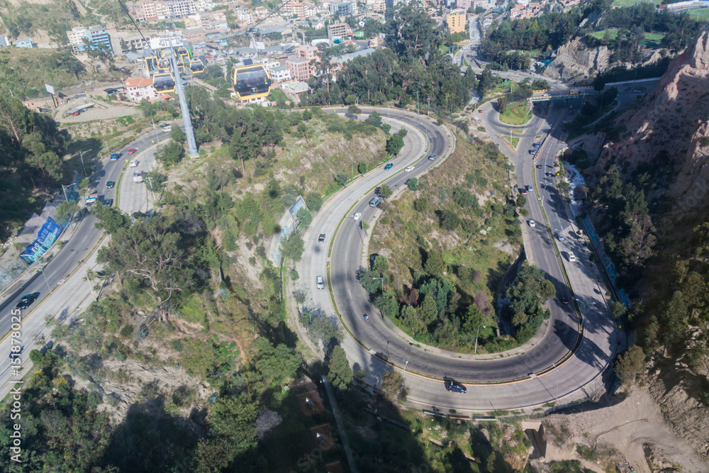LA PAZ, BOLIVIA - APRIL 28, 2015: Traffic on the winding highway in La Paz, Bolivia.