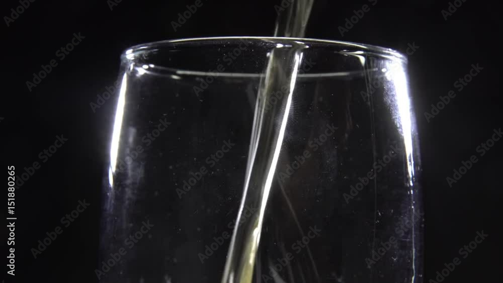A glass of beer on a black background A glass of beer on a black background